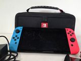 two nintendo wii controllers sitting next to each other on a table