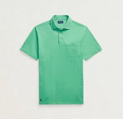 a green polo shirt with a pocket on the chest