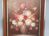 painting of a vase of flowers on a table in front of a blue wall