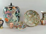 a lot of different vases that are sitting on a table