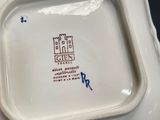 a white plate with a blue and red design on it