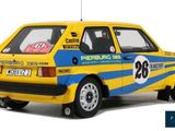 the yellow and blue car is parked on the side of the road