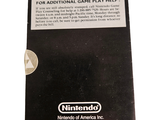 a nintendo game card sitting on top of a white table