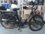 a bike that is parked in a garage with a box on the back