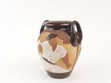 a vase that has a picture of a man on it