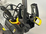 a black and yellow snow blower sitting on a table
