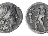 a silver coin with an image of a man and a woman on it