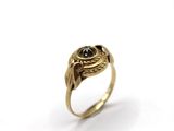 an image of a gold ring with a black stone in the center