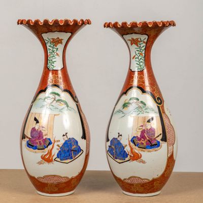 two vases that are sitting on a table