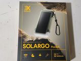 a close up of a box containing a solar charger on a table