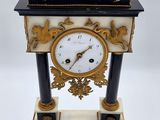 a clock that is sitting on top of a table