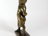bronze statue of a man with a hat on his head