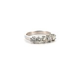a close up of a diamond ring on a white background