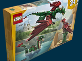 a box of legos with a dragon flying in the sky