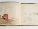 an open book with a drawing of a red bus on it