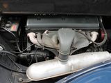 a small engine in the back of a blue car