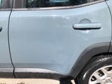 a car that has been painted blue and is parked on the side of the road