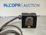 a close up of an electrical device on a table with a cord