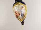 a blue and gold vase hanging from the ceiling