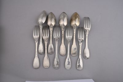 a lot of silver spoons and forks on the table