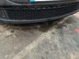 a close up of a front bumper of a car