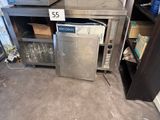 an image of a kitchen with a refrigerator and a microwave