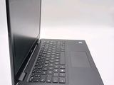 a black laptop with a black keyboard on a white surface