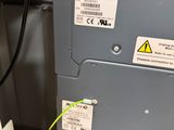 a close up of a machine with a yellow cord