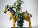figurine of a man riding a horse with a zebra on the back