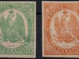a group of four different colored stamps on a black background
