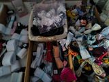 a box full of assorted items that are on the floor