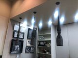 a picture of a bathroom with a mirror and lights