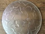 an image of a cake pan on a wooden table
