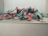 a pile of toothbrushes and toothpaste sitting on a counter
