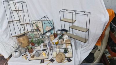 many items that are on a table with a white cloth