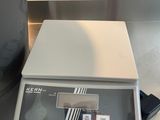 an image of a kitchen scale and a pot on a counter