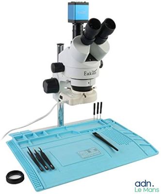 an image of a microscope that is sitting on top of a table
