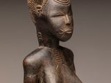 an image of a statue of a woman holding a baby