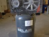 a small air compressor sitting on top of a table