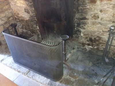 a large metal tub sitting in the middle of a room