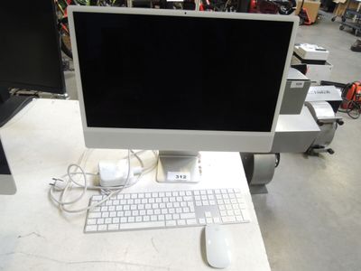 an image of a computer monitor and keyboard on a desk
