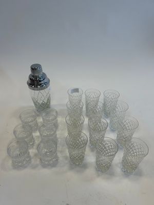 a lot of glasses and a shaker on the table