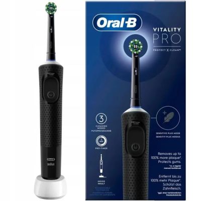 an image of a black and white electric toothbrush next to a box of toothpaste