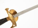 a close up of a sword on a white background