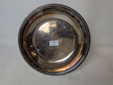 a silver plate that is sitting on a table