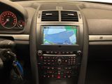 the dashboard of a car with a gps device in the center