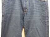 the back of a pair of jeans hanging on a hanger
