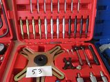 a red case with tools in it sitting on the floor