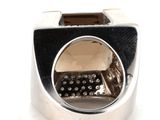 a close up of a silver ring with a keyboard inside of it