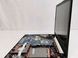 a laptop with a broken screen sitting on a table